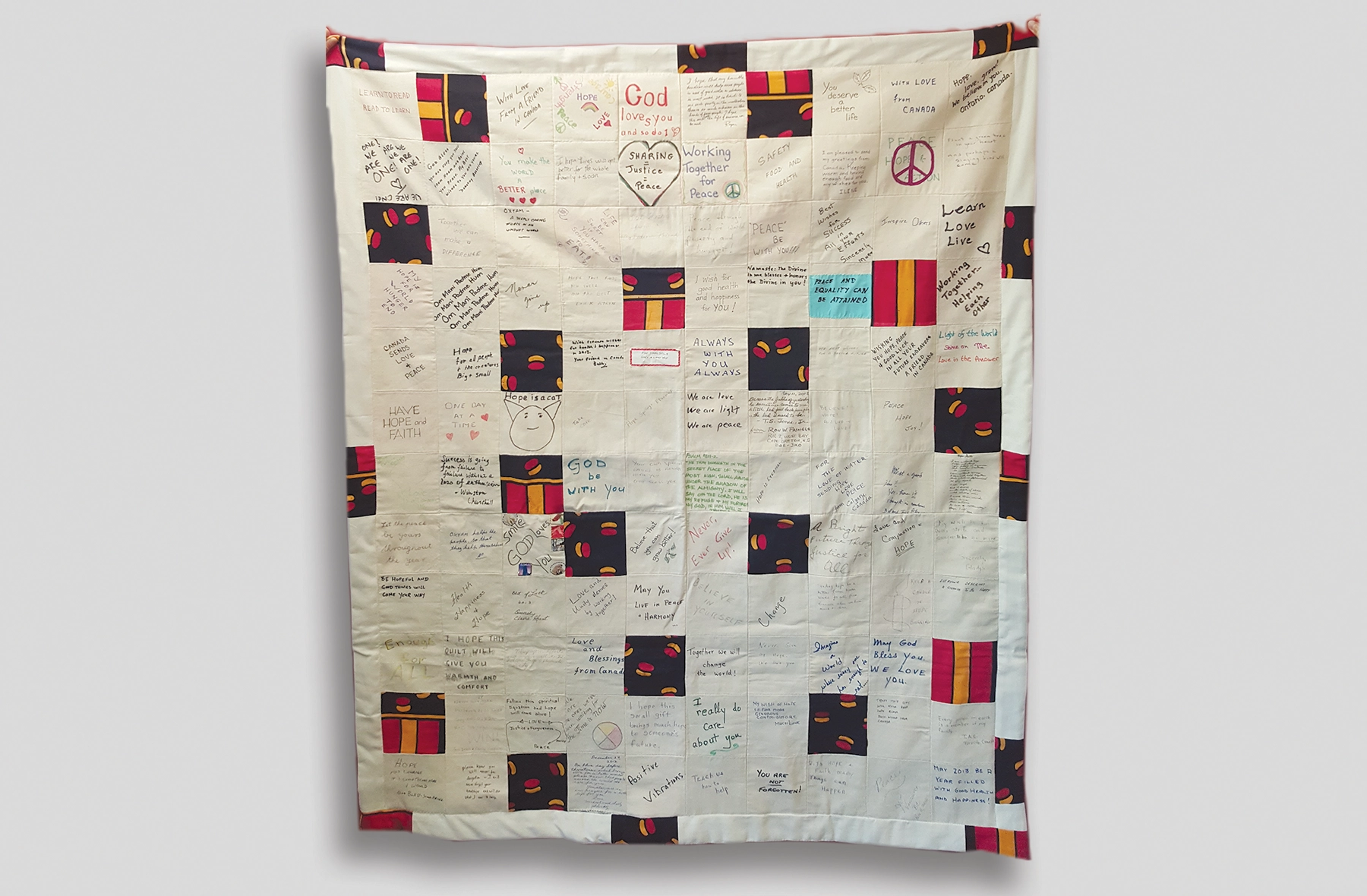 Oxfam Threads of change finished quilt